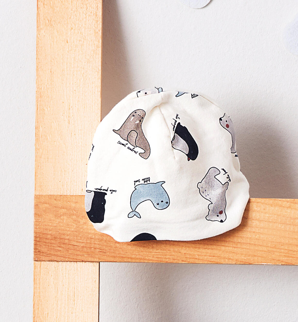 Cappellino neonato stampa allover PANNA iDO